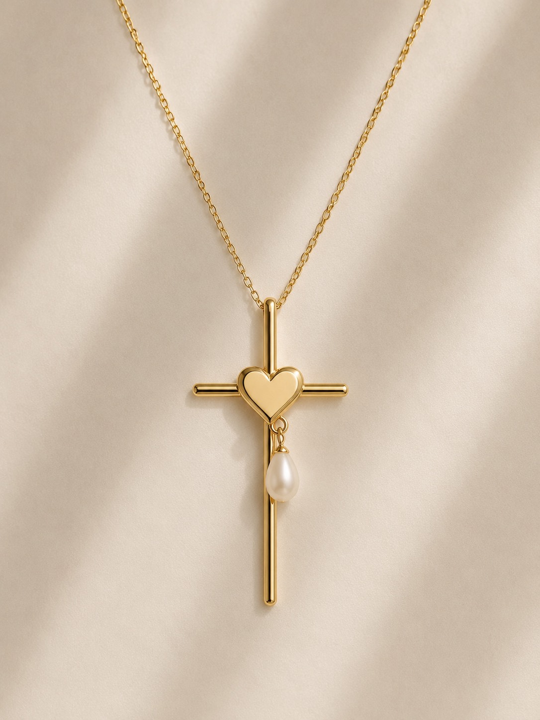 Heart Cross pendant in gold with solid heart and pearl drop