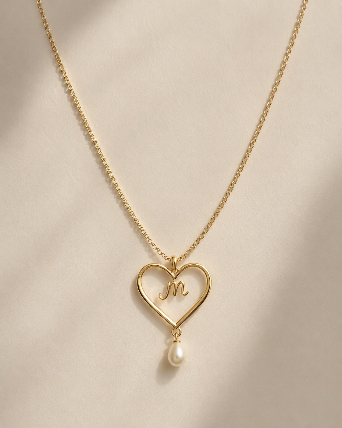 The Open Heart pendant with cursive initial and pearl drop